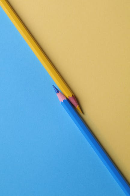two colorful pencils signifying brand color consistency management and designing process
