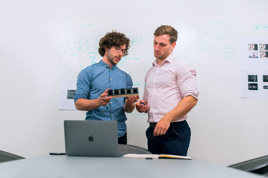 Two men in an office planning a product launch